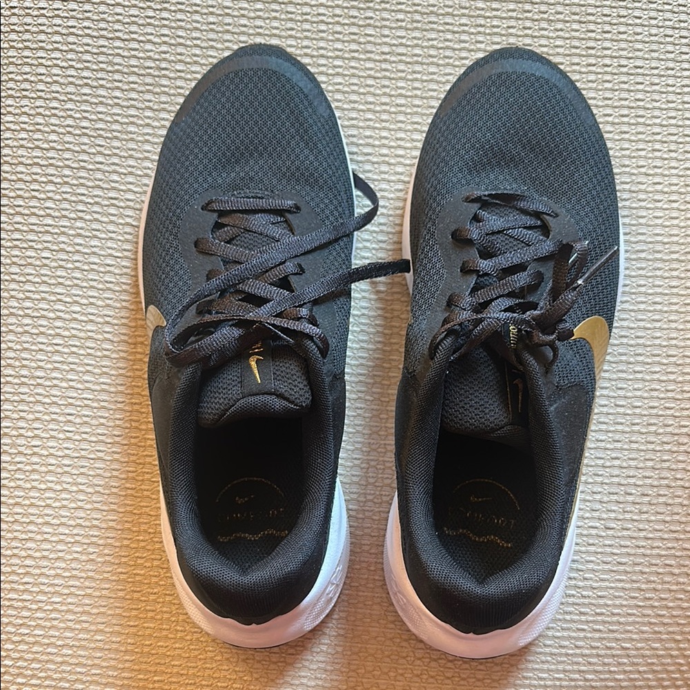 Nike Black and Gold Sneakers with Cushioned Sole